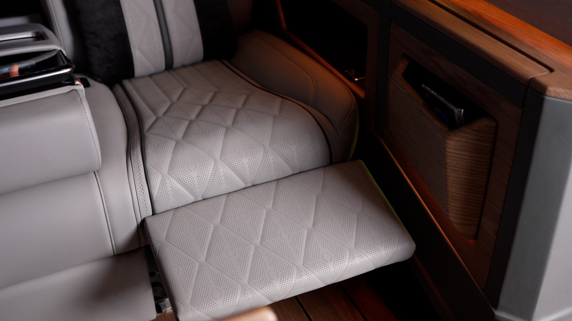 Extended leather passenger seat leg rest inside the Ilesbus Vito VIP